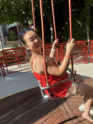 Miaomiao at the Family Swing attraction at the Adventure Land area of the Land of Legends theme park, viewed from a swing