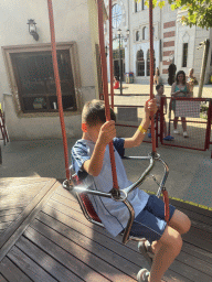 Max at the Family Swing attraction at the Adventure Land area of the Land of Legends theme park, viewed from a swing