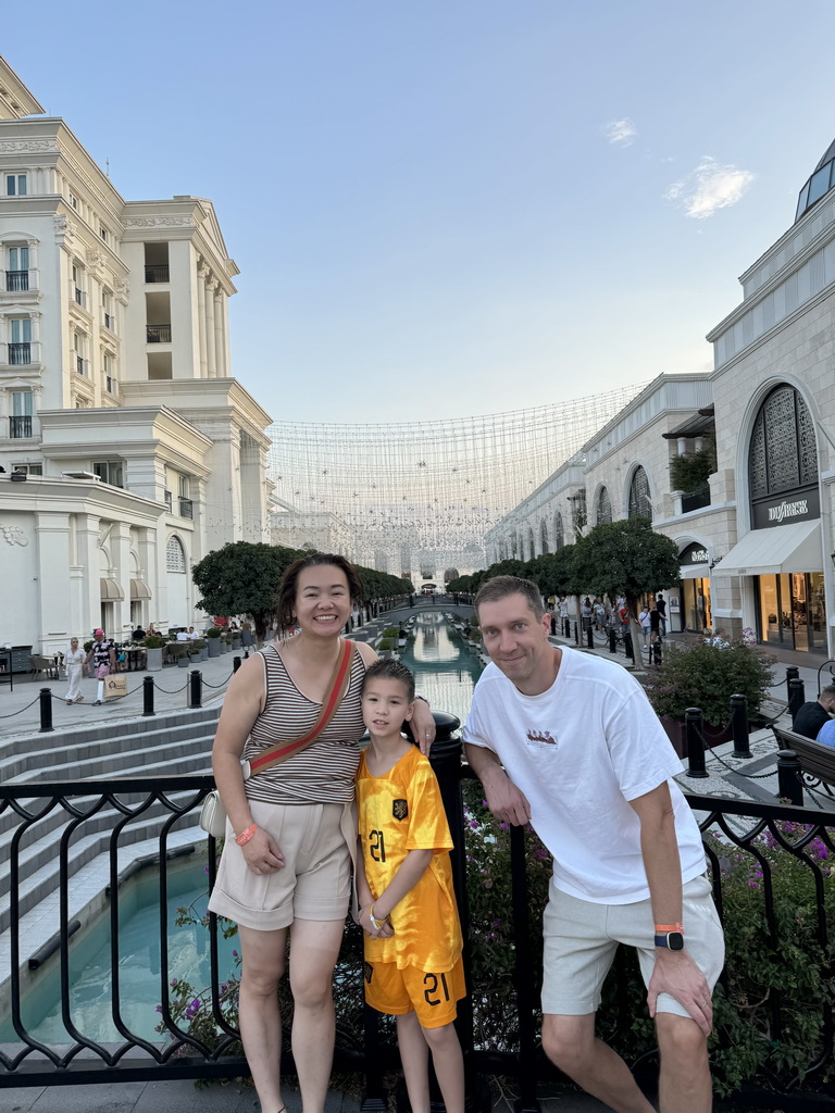 Tim, Miaomiao and Max on a bridge over the canal at the Shopping Avenue area of the Land of Legends theme park