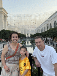 Tim, Miaomiao and Max on a bridge over the canal at the Shopping Avenue area of the Land of Legends theme park