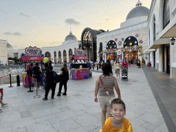 Miaomiao and Max in front of the Chimera Fountain and the Candy Candy store at the Shopping Avenue area of the Land of Legends theme park