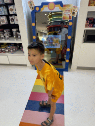 Max with a mirror at the Candy Candy store at the Shopping Avenue area of the Land of Legends theme park