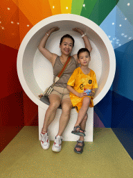 Miaomiao and Max in a chair at the Candy Candy store at the Shopping Avenue area of the Land of Legends theme park