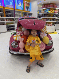 Max with a car at the Candy Candy store at the Shopping Avenue area of the Land of Legends theme park