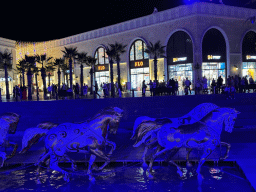Horse statues in front of the Chateau at the Shopping Avenue area of the Land of Legends theme park, by night