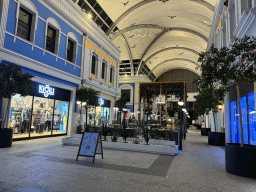 Shops and restaurants at the northeast side of the Shopping Avenue area of the Land of Legends theme park, by night