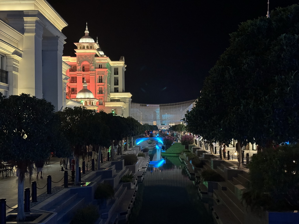 Bridge over the canal at the Shopping Avenue area of the Land of Legends theme park, during the Musical Boat Parade, by night