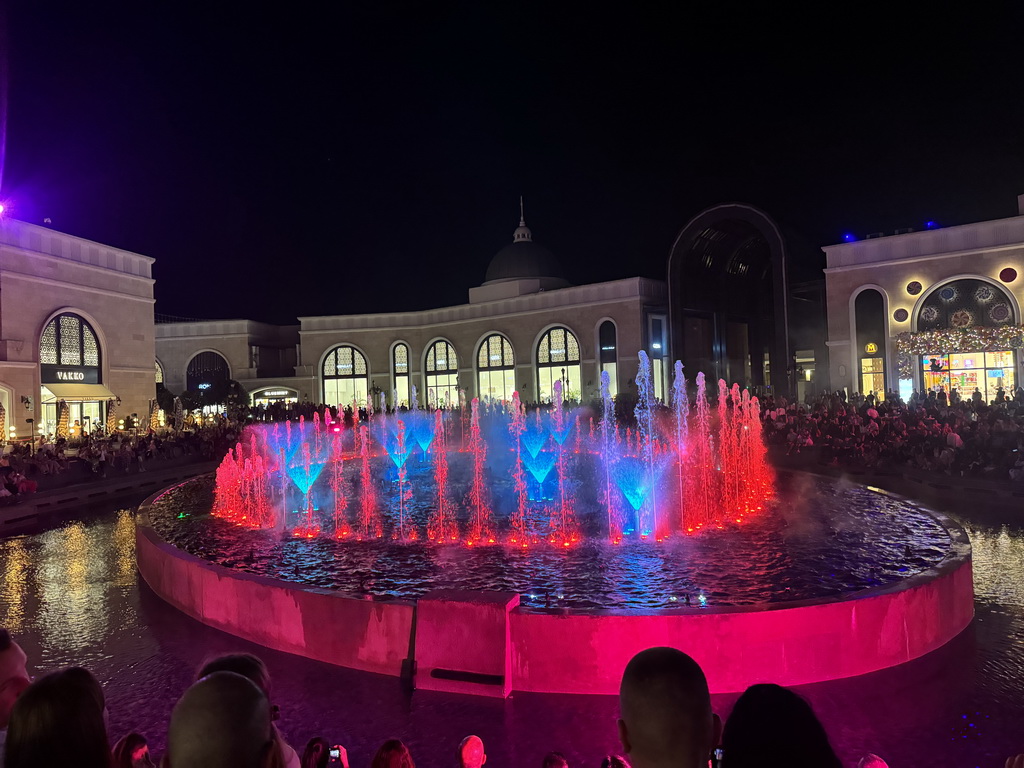 Light show at the Chimera Fountain at the Shopping Avenue area of the Land of Legends theme park, during the Musical Boat Parade, by night