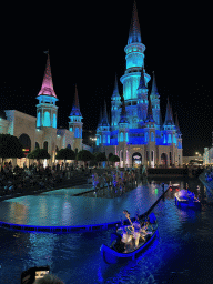 Boats with actors and horse statues in front of the Chateau at the Shopping Avenue area of the Land of Legends theme park, during the Musical Boat Parade, by night