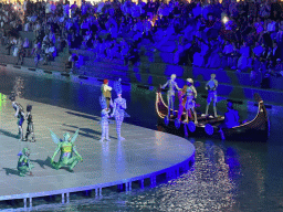 Boats and actors in front of the Chateau at the Shopping Avenue area of the Land of Legends theme park, during the Musical Boat Parade, by night