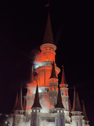 Smoke at the Chateau at the Shopping Avenue area of the Land of Legends theme park, during the Musical Boat Parade, by night