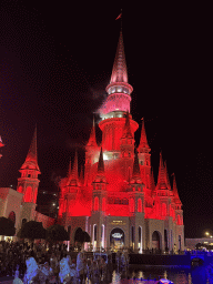 Horse statues and smoke at the Chateau at the Shopping Avenue area of the Land of Legends theme park, during the Musical Boat Parade, by night