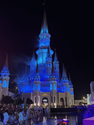 Horse statues and smoke at the Chateau at the Shopping Avenue area of the Land of Legends theme park, during the Musical Boat Parade, by night
