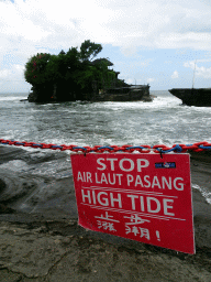 High tide sign in front of the Pura Tanah Lot temple