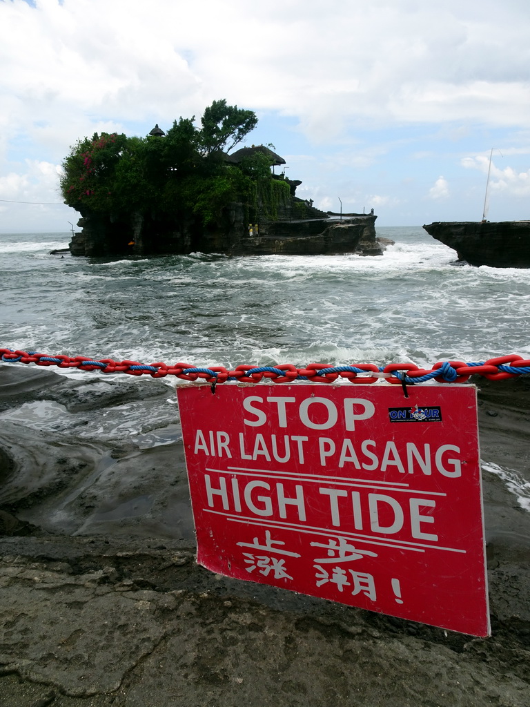 High tide sign in front of the Pura Tanah Lot temple