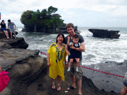 Tim, Miaomiao and Max at the shore at the Pura Luhur Penataran temple, with a view on the Pura Tanah Lot temple