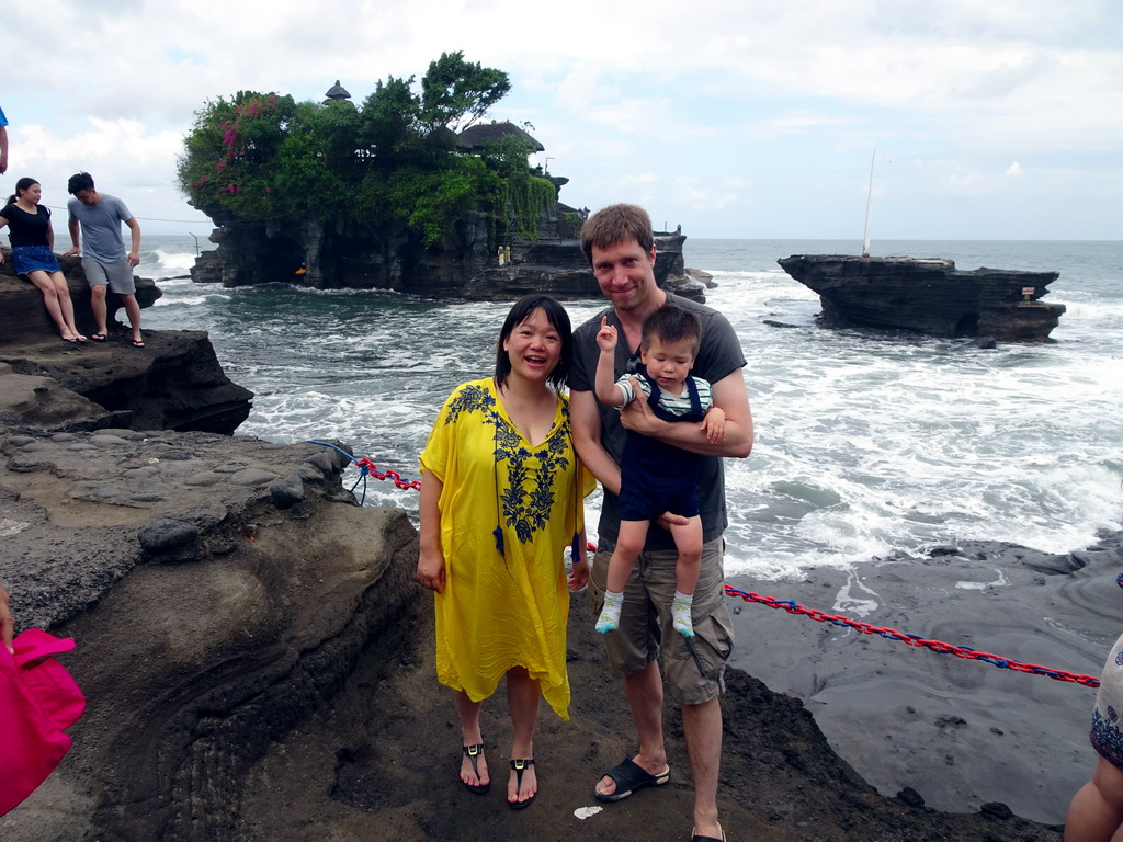 Tim, Miaomiao and Max at the shore at the Pura Luhur Penataran temple, with a view on the Pura Tanah Lot temple