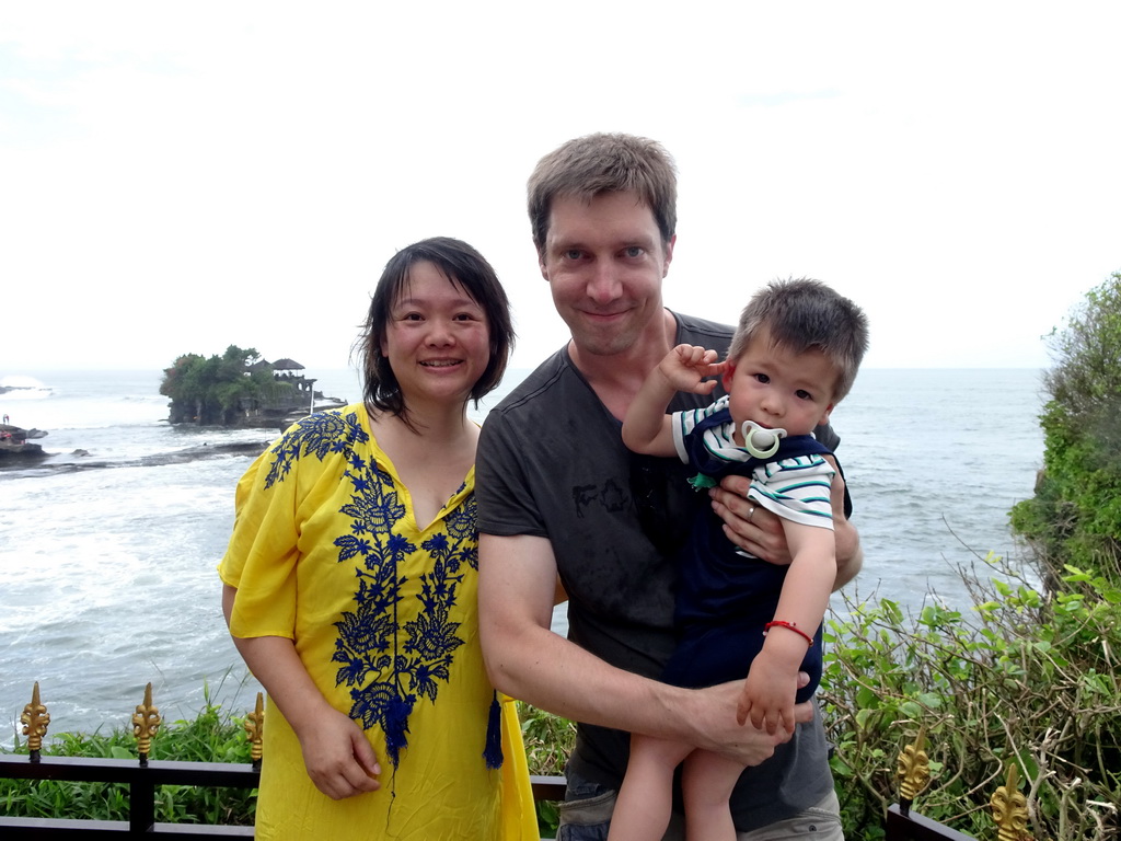 Tim, Miaomiao and Max in the gardens of the Pura Tanah Lot temple complex, with a view on the Pura Tanah Lot temple