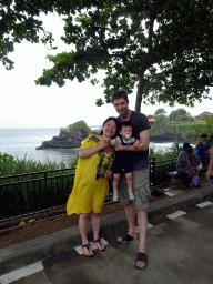 Tim, Miaomiao and Max in the gardens of the Pura Tanah Lot temple complex, with a view on the Pura Batu Bolong temple