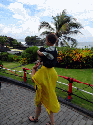 Miaomiao and Max in the gardens of the Pura Tanah Lot temple complex, with a view on the Pura Tanah Lot temple