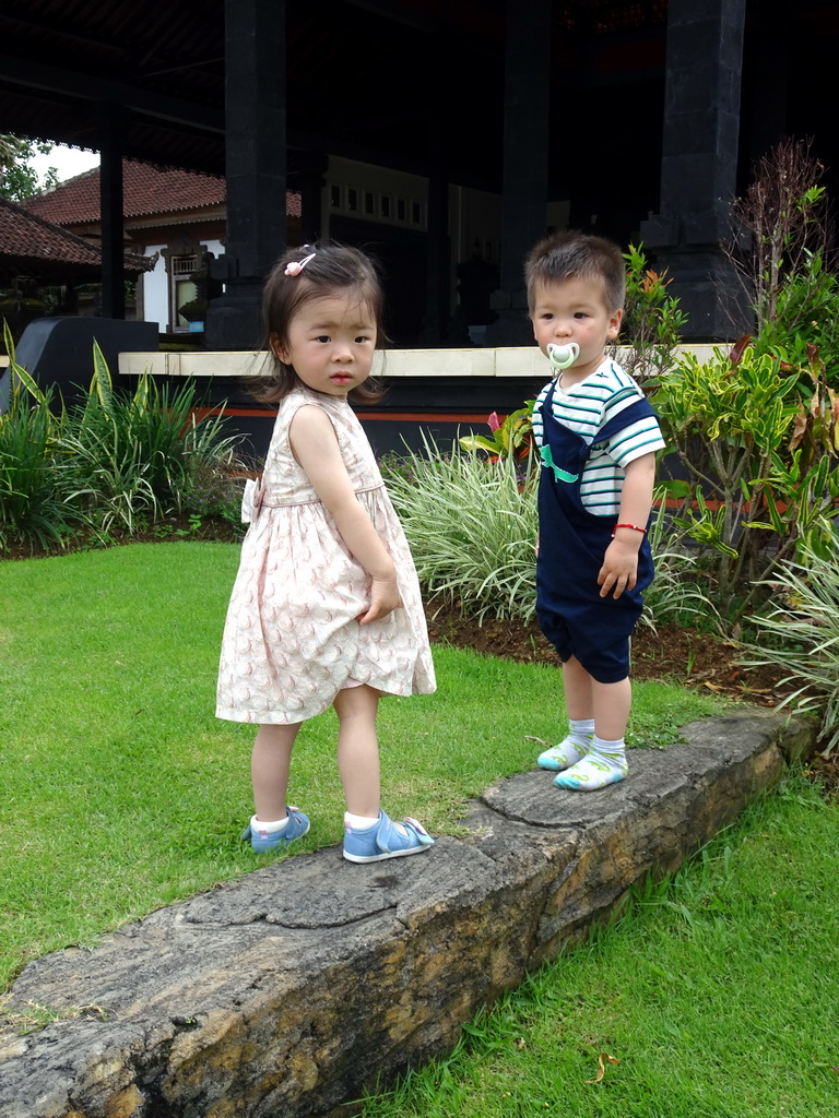 Miaomiao and a girl in front of the pavilion at the entrance to the Pura Tanah Lot temple complex