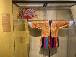 Fan and overcoat of a Korean Shaman at the exhibition `Healing Power` at the Ground Floor of the Africa Museum, with explanation