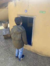 Max in front of the room of the youngest son at the Ghana village at the Museumpark of the Africa Museum