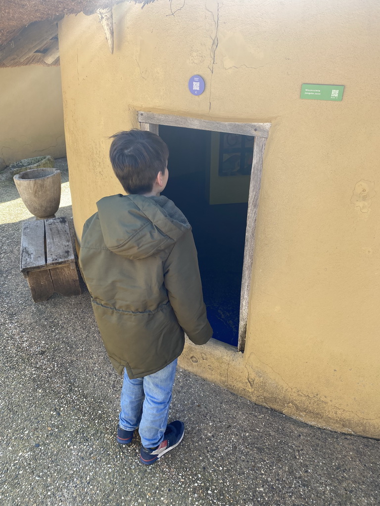 Max in front of the room of the youngest son at the Ghana village at the Museumpark of the Africa Museum