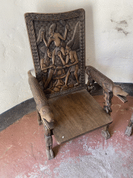 Wooden chair in a house at the main square of the Museumpark of the Africa Museum