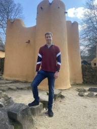 Tim in front of a house at the Mali village at the Museumpark of the Africa Museum