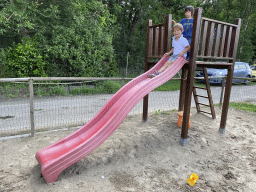 Max and his friend on the slide at the playground at the FrankenFruit fruit farm