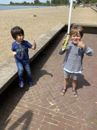 Max and his friend with an ice cream at the beach at the Binnenschelde lake