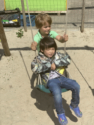 Max and his friend on the slide at the playground at the FrankenFruit fruit farm