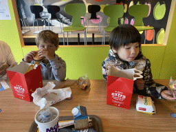 Max and his friend having lunch at the McDonald`s restaurant