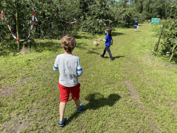 Max and his friend picking cherries at the FrankenFruit fruit farm