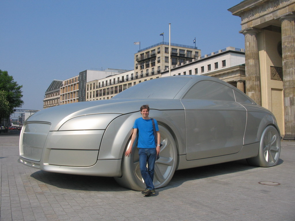 Tim with a giant Audi car at the back side of the Brandenburger Tor gate