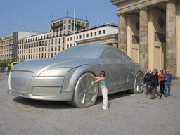 Miaomiao with a giant Audi car at the back side of the Brandenburger Tor gate