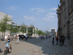 The Paul-Löbe-Allee street with the north side of the Reichstag building and the Fernsehturm tower