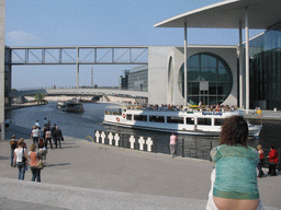Miaomiao in front of the Spree river and the Marie-Elisabeth-Lüders-Haus building