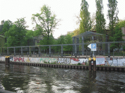 The Spree river and a park at the Friedrichstraße street, viewed from the tour boat