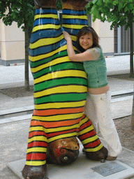 Miaomiao with a United Buddy Bear statue at the St. Wolfgang-Straße street