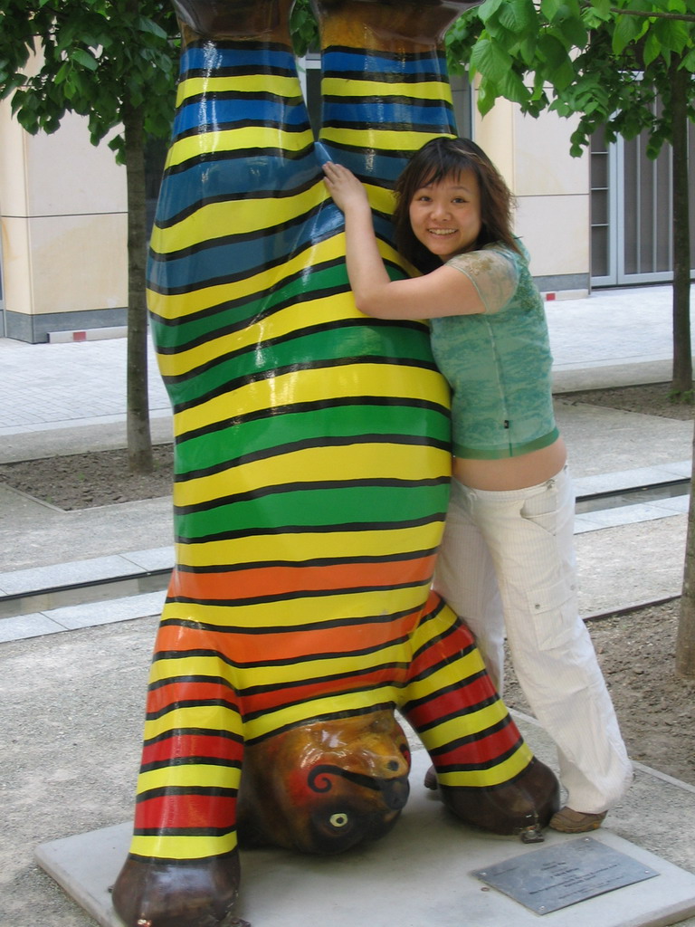 Miaomiao with a United Buddy Bear statue at the St. Wolfgang-Straße street