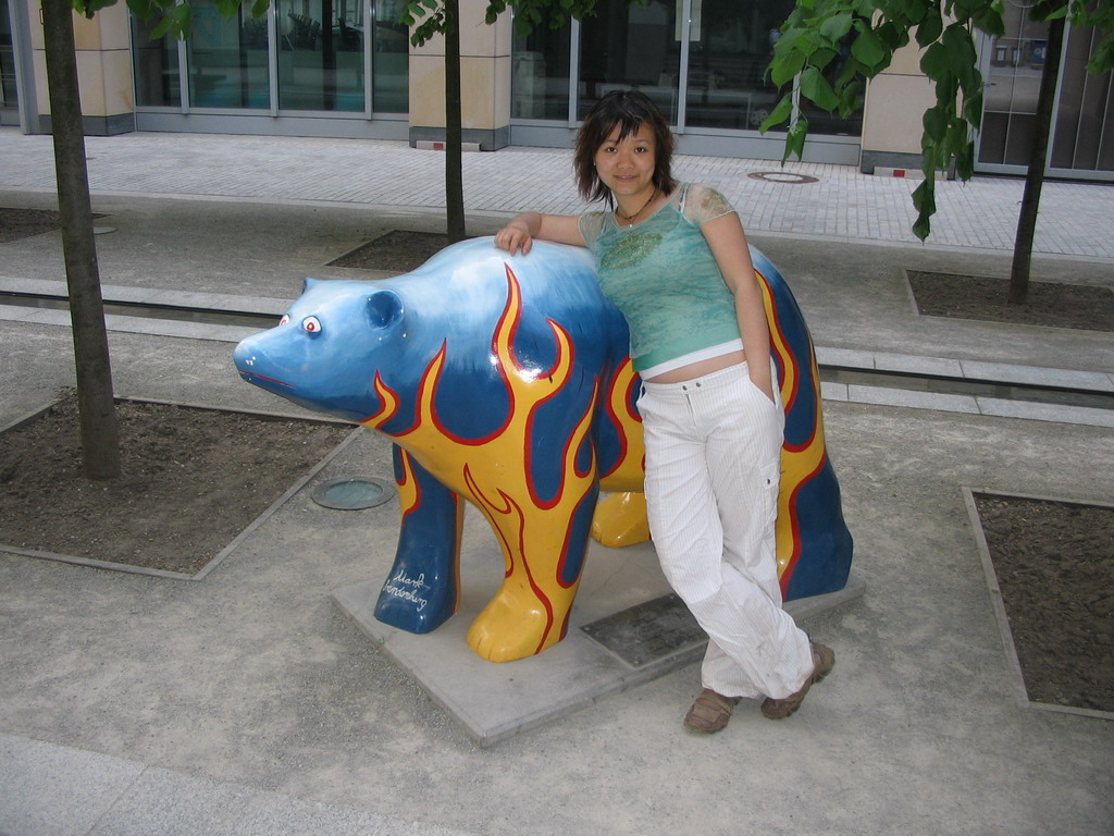 Miaomiao with a United Buddy Bear statue at the St. Wolfgang-Straße street