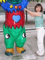 Miaomiao with a United Buddy Bear statue at the St. Wolfgang-Straße street