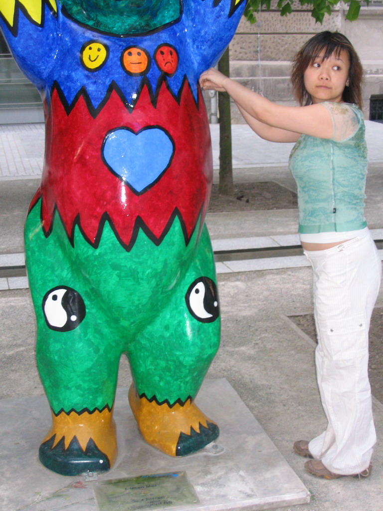 Miaomiao with a United Buddy Bear statue at the St. Wolfgang-Straße street