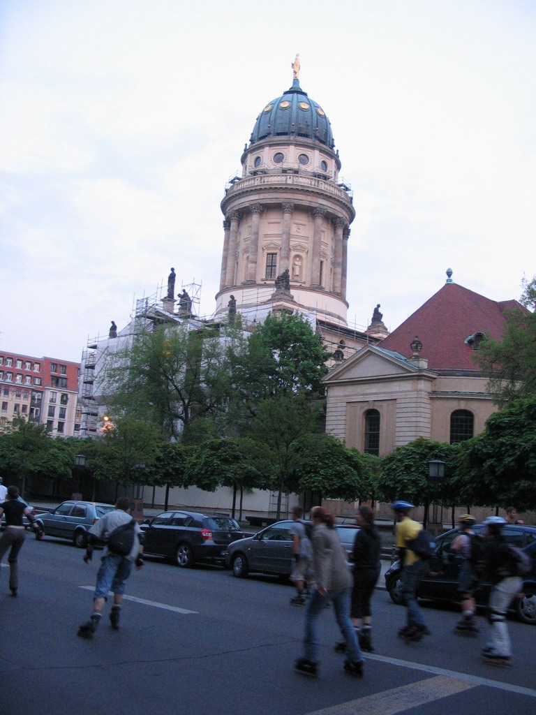 Skaters and the northwest side of the French Cathedral at the Französische Straße street