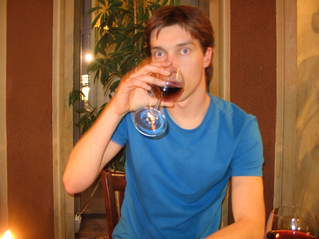 Tim having a drink in a restaurant in the city center