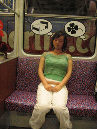 Miaomiao sleeping in a subway train