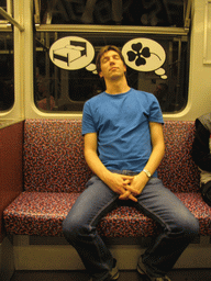 Tim sleeping in a subway train