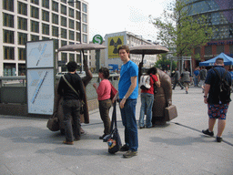 Tim with statues at the Potsdamer Platz square